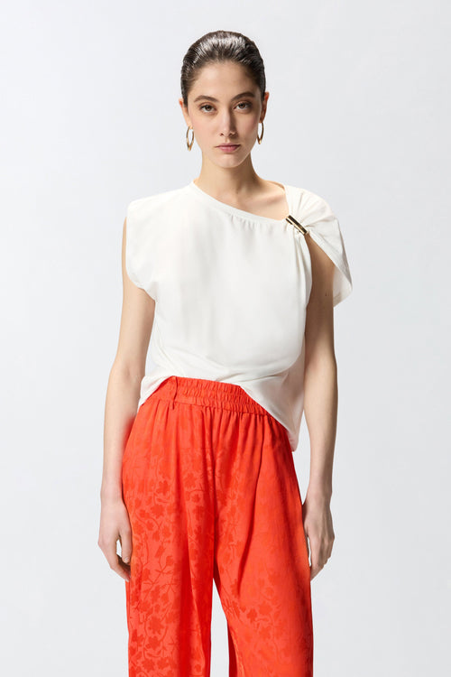 Top Pinko in cotone con applicazione in metallo dorato