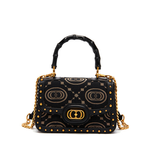 La Carrie handbag in monogram fabric and leather